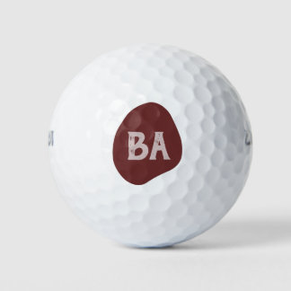 Monogramm-Anfangsbuchstaben in Rosé auf Burgunder- Golfball