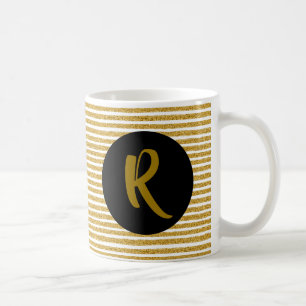Monogramm auf der Tasse des Goldenen Glitzer