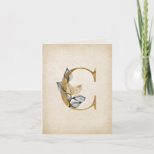 Monogramm aus Gold und Schwarz mit Blätter