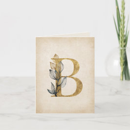 Monogramm aus Gold und Schwarz mit Blätter