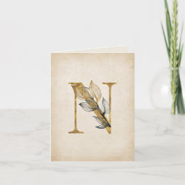 Monogramm aus Gold und schwarzer Blüte mit Blätter