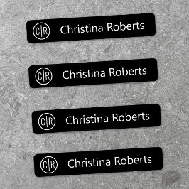 Monogramm-Initialen und schwarze Textilien Etiketten