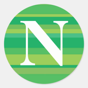 Monogramm mit einem bunten gestreiften Hintergrund Runder Aufkleber