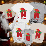 Monogramm Personalisiert mit Name T-Shirt<br><div class="desc">Erstellen Sie dauerhafte Erinnerungen mit der Monogram Personalisiert mit Name Familie Weihnachten T - Shirt. Diese familiären Weihnachtsfeier-Shirts sind so konzipiert, dass Ihre Feierlichkeiten festlicher und persönlicher werden. Jedes Shirt verfügt über ein spielerisches Monogramm, das mit einem Weihnachtselfenhut geschmückt ist und Ihrem Urlaubsstil ein fröhliches und fröhliches Element verleiht. Diese...</div>