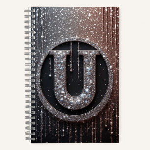 Monogramm U mit glitzernden Tropfen Notizbuch