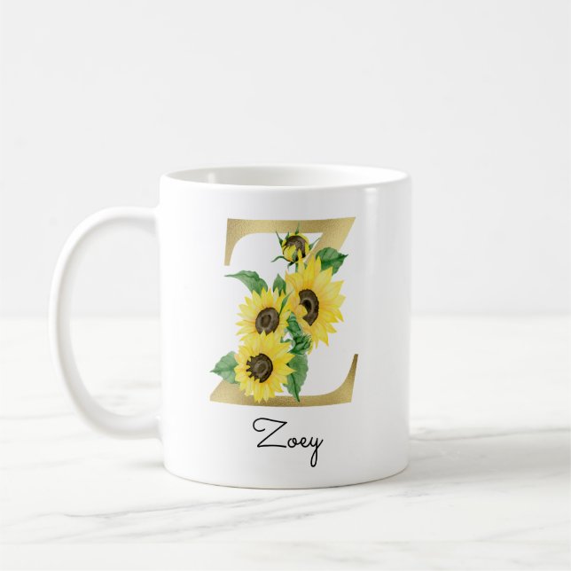 Monogrammierte goldene Sonnenblumen-Blumeninitiale Kaffeetasse (Links)