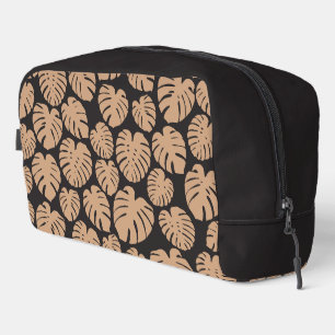 Monstera in Beige und Schwarz Waschbeutel