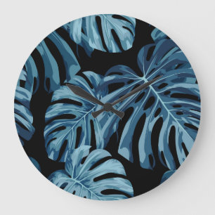 Monstera-Pflanze: blaues Blätter-Muster. Große Wanduhr
