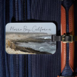 Morro Bay California Ocean Cliffs Photography Gepäckanhänger<br><div class="desc">A foggy overcast day in Morro Bay California with the ocean waves hitting the rocks on the shore in this beach photograph souvenir. This seaside travel photo luggage tag features black cursive script above the beach rocks and grey sky.</div>