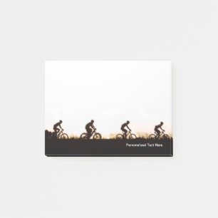 Mountainbike-Fahrer auf dem Weg über den Damm Post-it Klebezettel