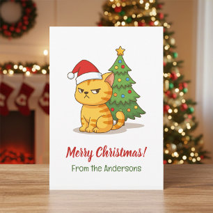 Mürrische getigerte Katze mit roter Weihnachtsmütz Feiertagskarte