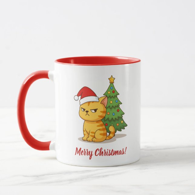 Mürrische orange getigerte Katze mit roter Weihnac Tasse (Links)