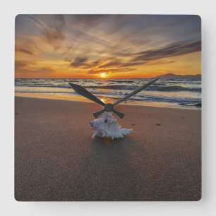 Muschel am Strand in Insel des Sonnenuntergang-  Quadratische Wanduhr