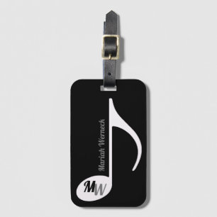 musikalische Note auf schwarzem Taschenschild mit Gepäckanhänger