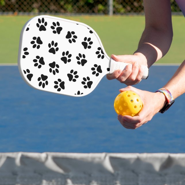 Muster von Pfoten, Hundeschäften, schwarzen Pfoten Pickleball Schläger (InSitu)