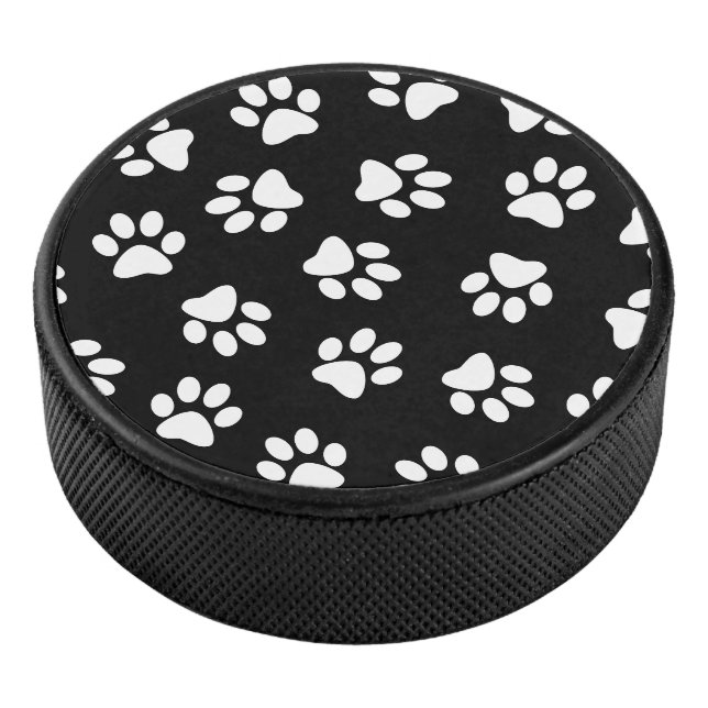 Muster von Pfoten, Hundeschäften, weißen Pfoten Eishockey Puck (3/4)