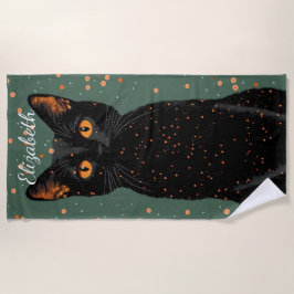 Mystische schwarze Katze mit orangefarbenen Augen Strandtuch
