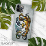Mythische keltische Drachen Fantasie Tattoo Art iPhone 15 Pro Max Hülle<br><div class="desc">Schöne, farbenfrohe und zeitgenössische alte Schule Tätowierdesign von silberblauen und goldgelben Drachen mit ihrem Ei halten. Auf blaugrauem grauem grunem Hintergrund. Die Drachen zeigen Männlichkeit und Weiblichkeit, Zusammengehörigkeit, Familie, Gleichheit, Gut und Böse oder Dunkel und Licht. Dieses originelle, trendige, moderne und skurrile Hipster Design wurde für Tätowierkünstler, Drache, Fantasiewesen, Science...</div>