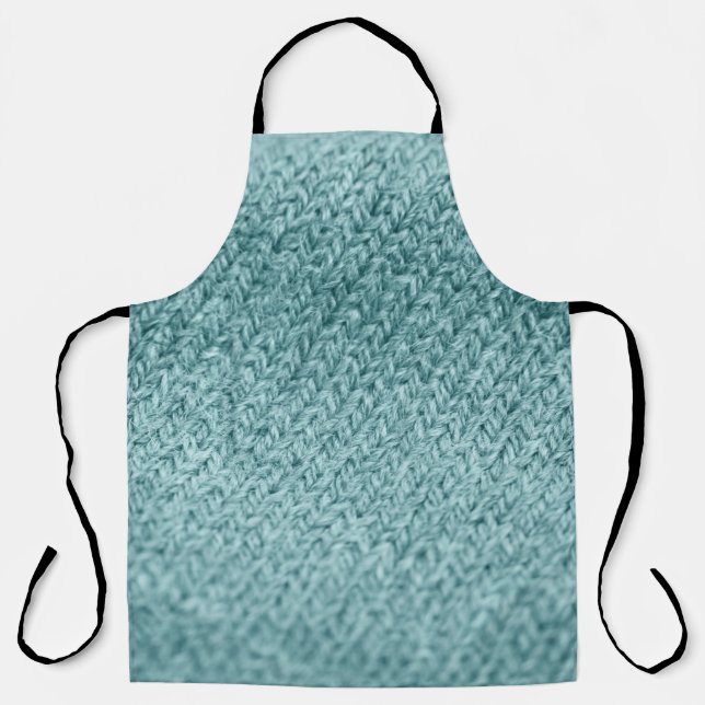 Nah aus grün gestricktem Hintergrund.  Schürze (Vorderseite)