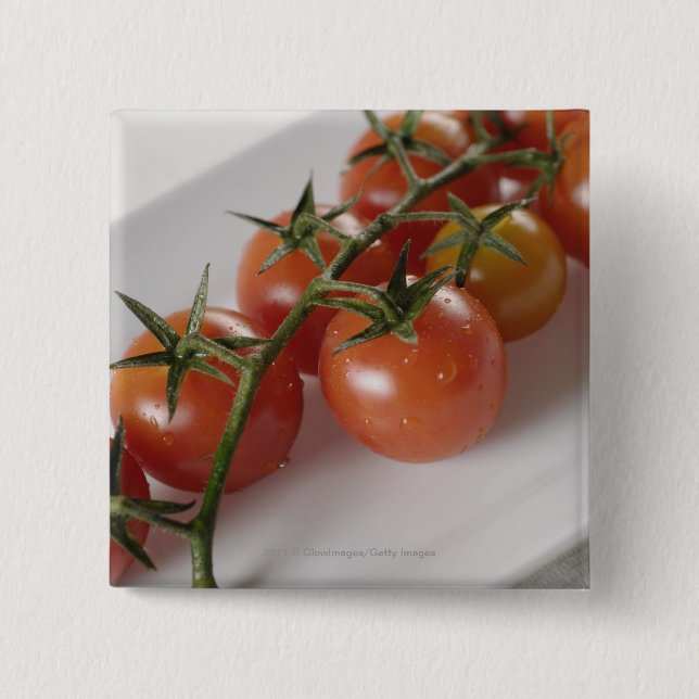 Nahaufnahme der Tomaten auf einem Behälter Button (Vorderseite)