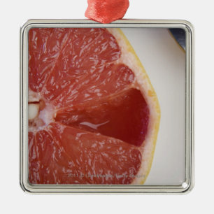 Nahaufnahme einer Scheibe der Orange und des Ornament Aus Metall