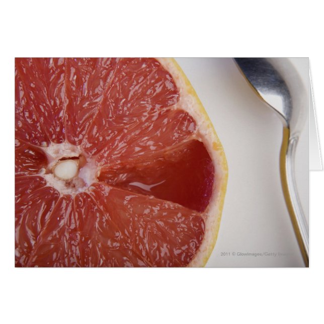 Nahe Orangenscheibe und Löffel (Vorderseite (Horizontal))