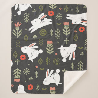 Nahtloses Muster auf dunklem Hintergrund. Niedlich Sherpadecke