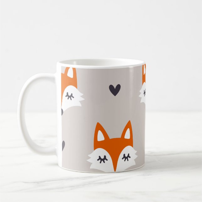 Nahtloses Muster mit Fuchsgesichtern. Handgezogene Kaffeetasse (Links)