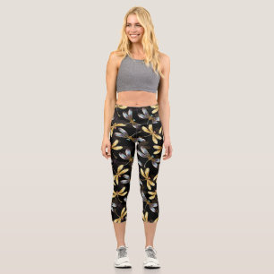 Nahtloses Muster mit goldenen Libellen Capri Leggings