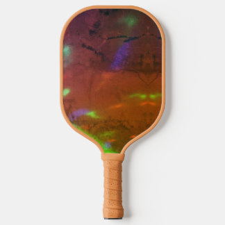 neon lights on cracked rock surface pickleball schläger