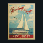 New Jersey Sailboat Vintage Travel Postkarte<br><div class="desc">Dieses Greetings From New Jersey Jahrgang Reise nautische Design verfügt über ein Boot,  das auf dem Wasser mit Möwen segeln und einen blauen Himmel gefüllt mit prächtigen puffigen weißen Wolken.</div>