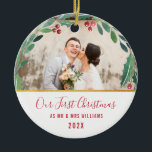 Newlyweds first christmas keramik ornament<br><div class="desc">Winter wreath with foliage and red berries. The images can be personalized and edited for size,  placement and the text and colors.</div>