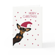 Niedliche Dackel mit Weihnachtsmannmütze-frohen