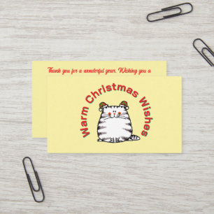 Niedliche dicke Katze mit zwei Weihnachtsmützen un Visitenkarte