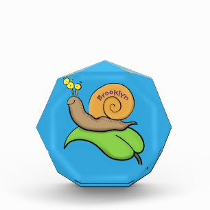 Niedliche, glückliche Schnecke auf einer Cartoon-I Fotoblock