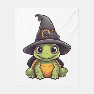 Niedliche Halloweenschildkröte mit Hexenhut. Fleecedecke