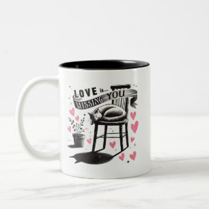 Niedliche Katze auf einem Stuhl Vermisst Zweifarbige Tasse
