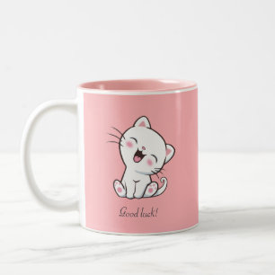 Niedliche Katze und Herz auf rosa Zweifarbige Tasse