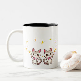 Niedliche Katzen, die Zauber in den Mauerspitzen h Zweifarbige Tasse