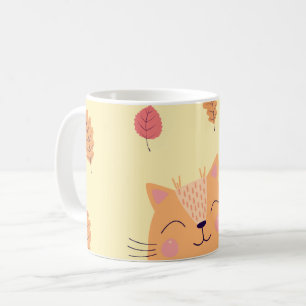 Niedliche orangefarbene Katze spielt im Herbstlaub Kaffeetasse