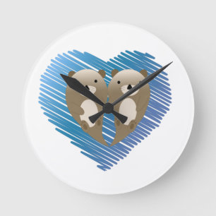 Niedliche Otters mit blauem Herzen im Hintergrund Runde Wanduhr