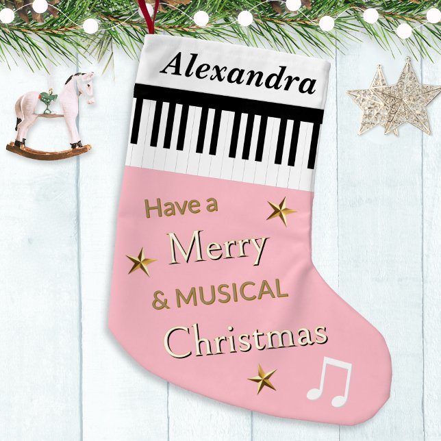 Niedliche Piano Keys Personalisiert Kleiner Weihnachtsstrumpf (A personalized Christmas stocking in pink, with piano keys, festive greeting, stars and music notes)