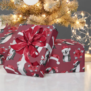 Niedliche Pinguine in Weihnachtshasen Rot Geschenkpapier