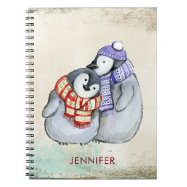 Niedliche Pinguine in Winterskarven und Hats nach Notizblock