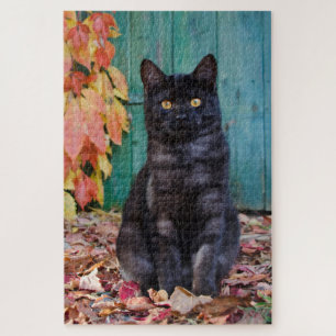 Niedliche schwarze Katze Kitten mit roten Blätter  Puzzle