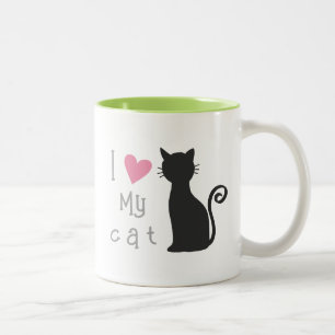 Niedliche schwarze Katze mit hübschem rosa Herz Zweifarbige Tasse