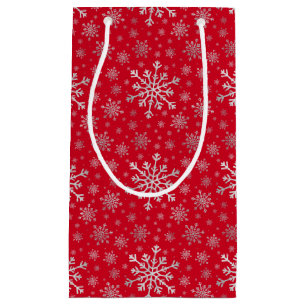 Niedliche Silbergraue Weihnachtsschneeflocken auf Kleine Geschenktüte