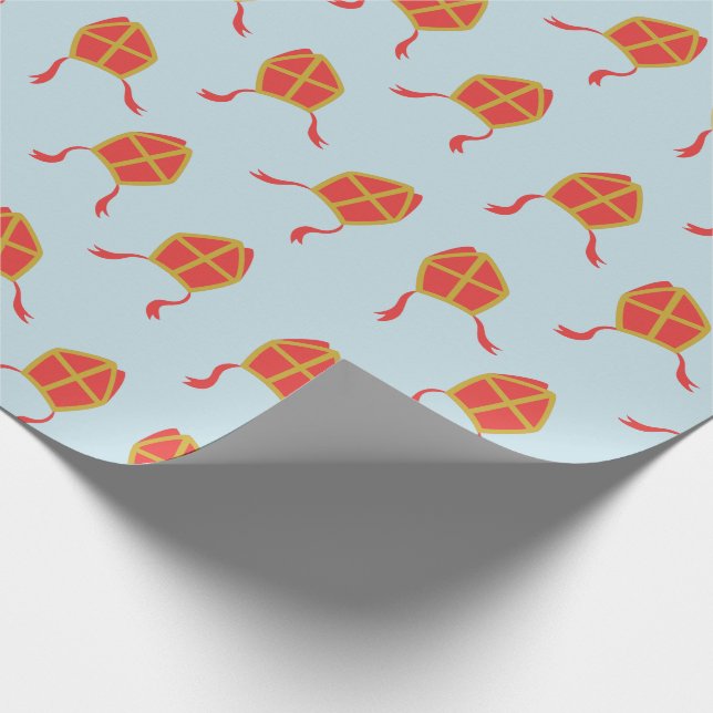 Niedliche Sinterklaas-Mijters auf hellblau Geschenkpapier (Ecke)