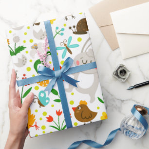 Niedliche und farbenfrohe Ostersymbole Nahtloses M Geschenkpapier