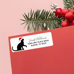 Niedliche Weihnachtskatze in Weihnachtsmannmütze R